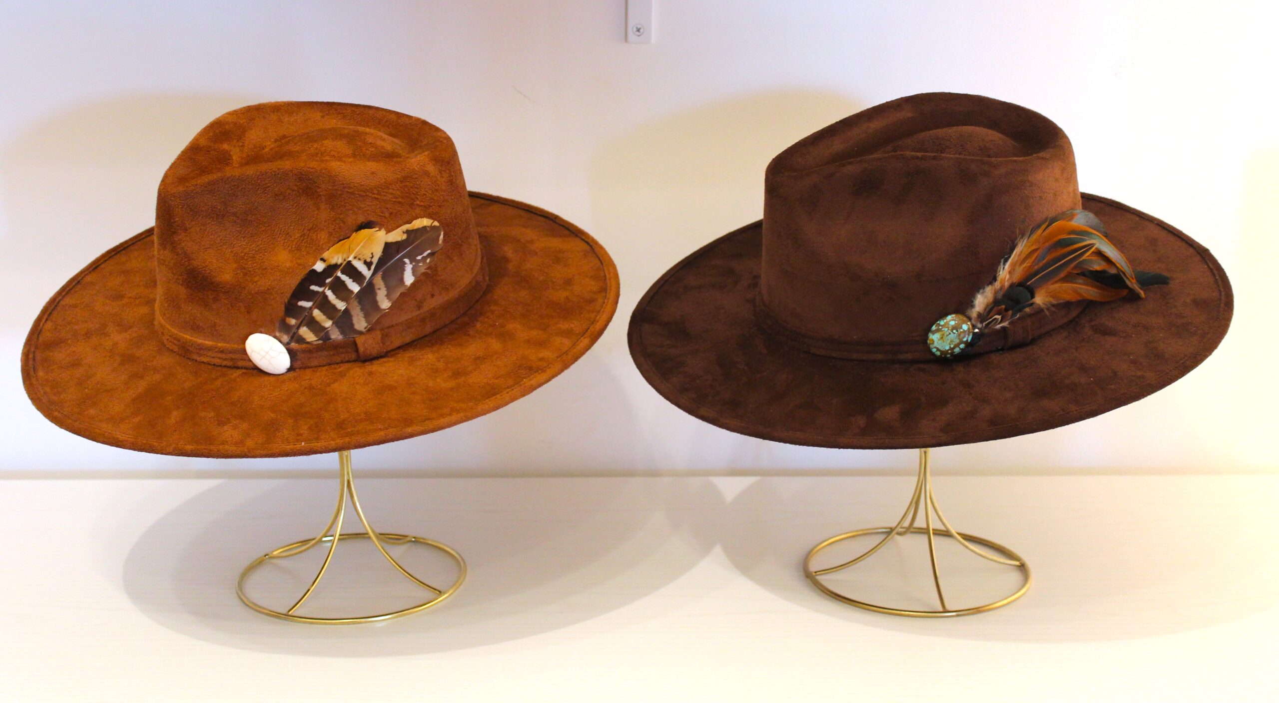 Handmade Anahata hat in burnt orange and black, adorned with crystals and feathers for a spiritual Sedona vibe.